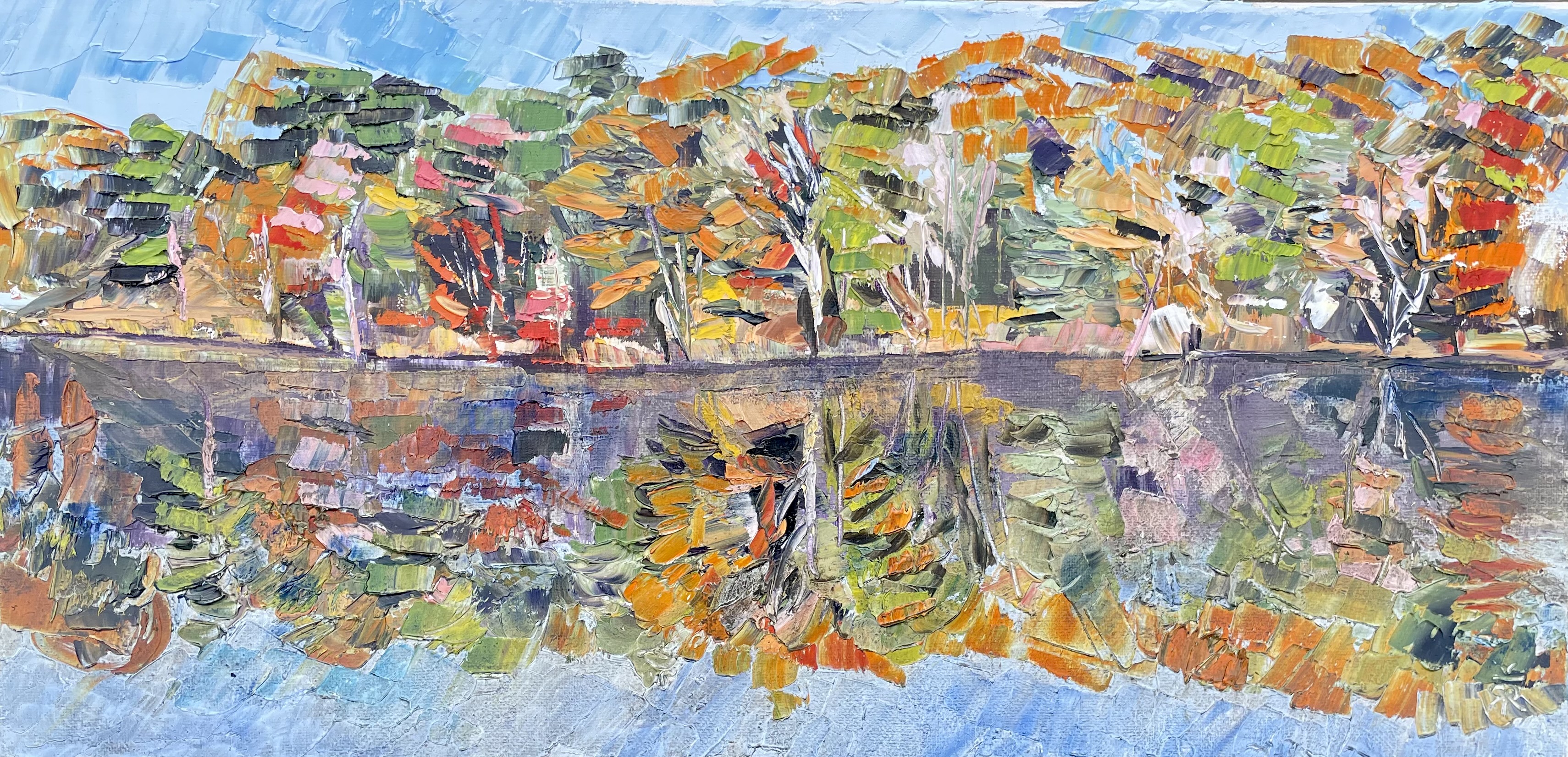 Painting of fall trees on the edge of a pond with a reflection